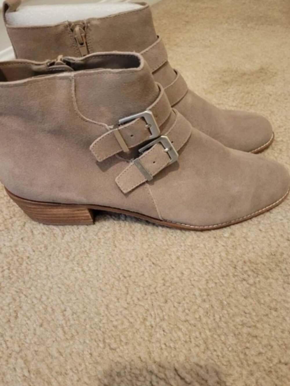 Light tan suede ankle boots with side zip and buckle trim.  1 1/2 " heel.